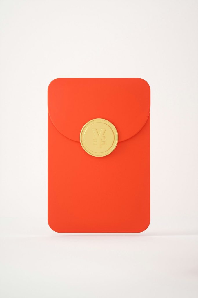 a-red-envelope-with-a-gold-button-on-it-s-etxtq9j00